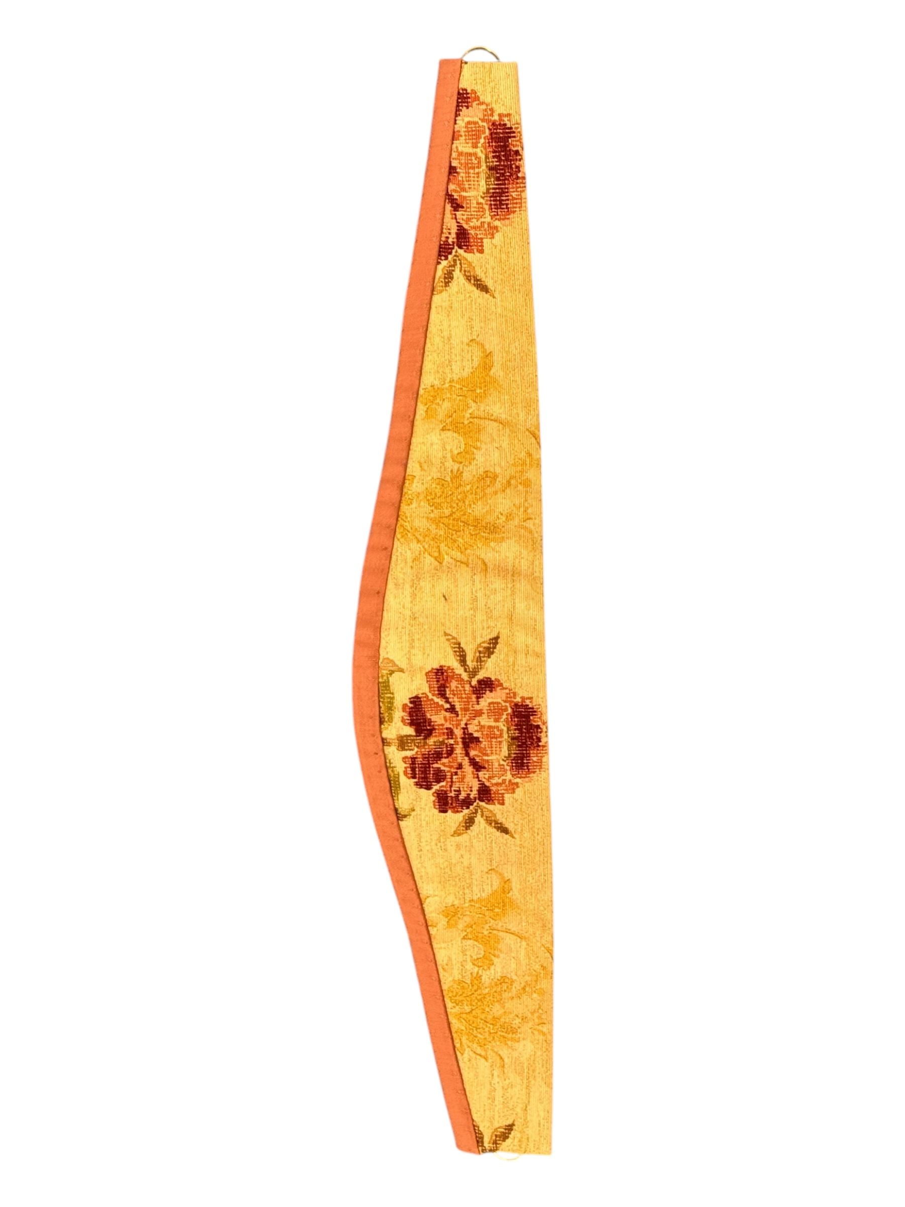 Mid-20th century quilted bedspread and matching valance, the bedspread displaying a warm gold floral pattern with burgundy highlights, complemented by a terracotta fabric trim, together with coordinating terracotta valance with tassels