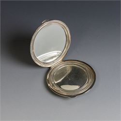 Two silver compact mirrors, comprising a Kigu powder compact with engine turned decoration and a compact mirror with floral decoration, both hallmarked