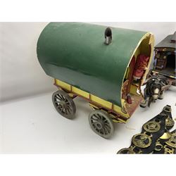 Two ceramic shire horse and gypsy caravans, together with horse brasses 