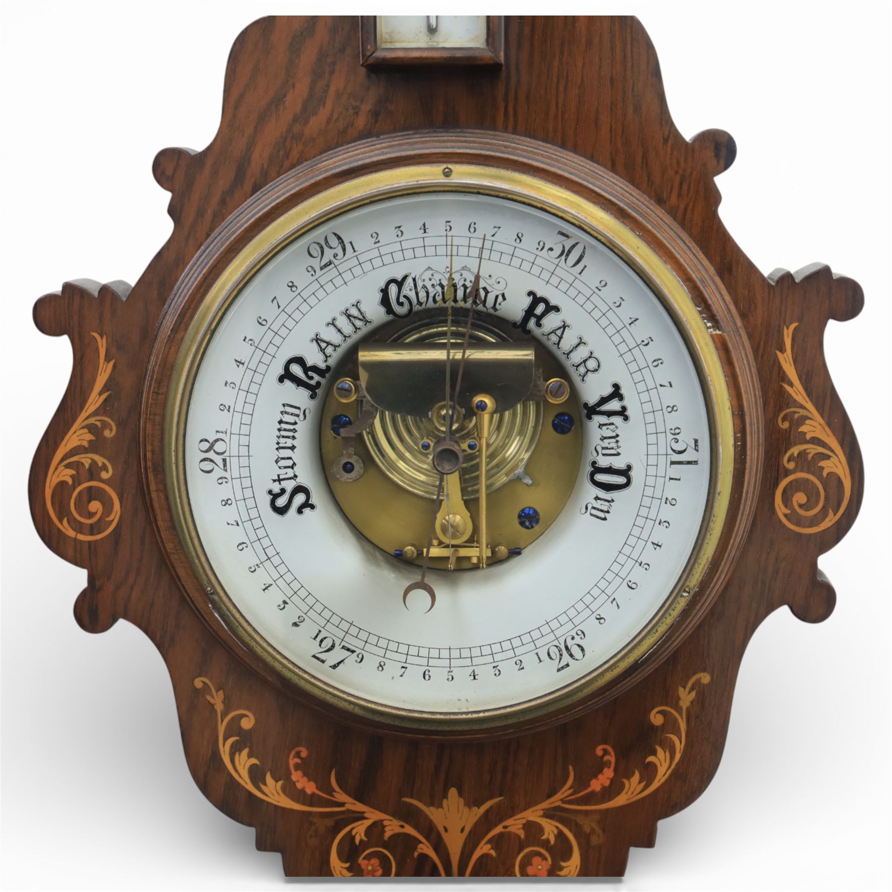 Victorian inlaid rosewood aneroid wall barometer, the circular glass-printed dial with brass bezel, with weather indications for Stormy, Rain, Change, Fair, and Very Dry, with enclosed aneroid movement beneath, shaped case with marquetry scrolls and foliate motifs surmounted by a thermometer with dual Fahrenheit and Centigrade scales, circa 1890-1900