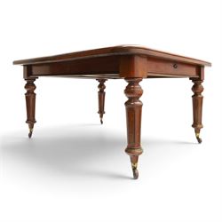 19th century mahogany extending dining table, rectangular top with rounded corners raised on turned and fluted supports with brass cups and castors, with two additional leaves; with set of eight (6+2) Regency design mahogany dining chairs, spiral-reeded back-bar over drop-in seats and sabre supports (W54cm H85cm)