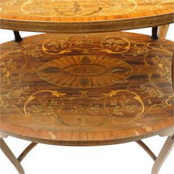 Edwardian Sheraton Revival inlaid mahogany and satinwood marquetry oval two-tier étagère occasional table, the oval top with removable glazed tray with brass handles, over an ornately inlaid top with central patera motif and trailing foliate scrolls, the splayed uprights inlaid with bellflowers, over a matched inlay under-tier, raised on splayed supports united by curved X-stretcher,  retailed by David Hick Interiors, Jersey