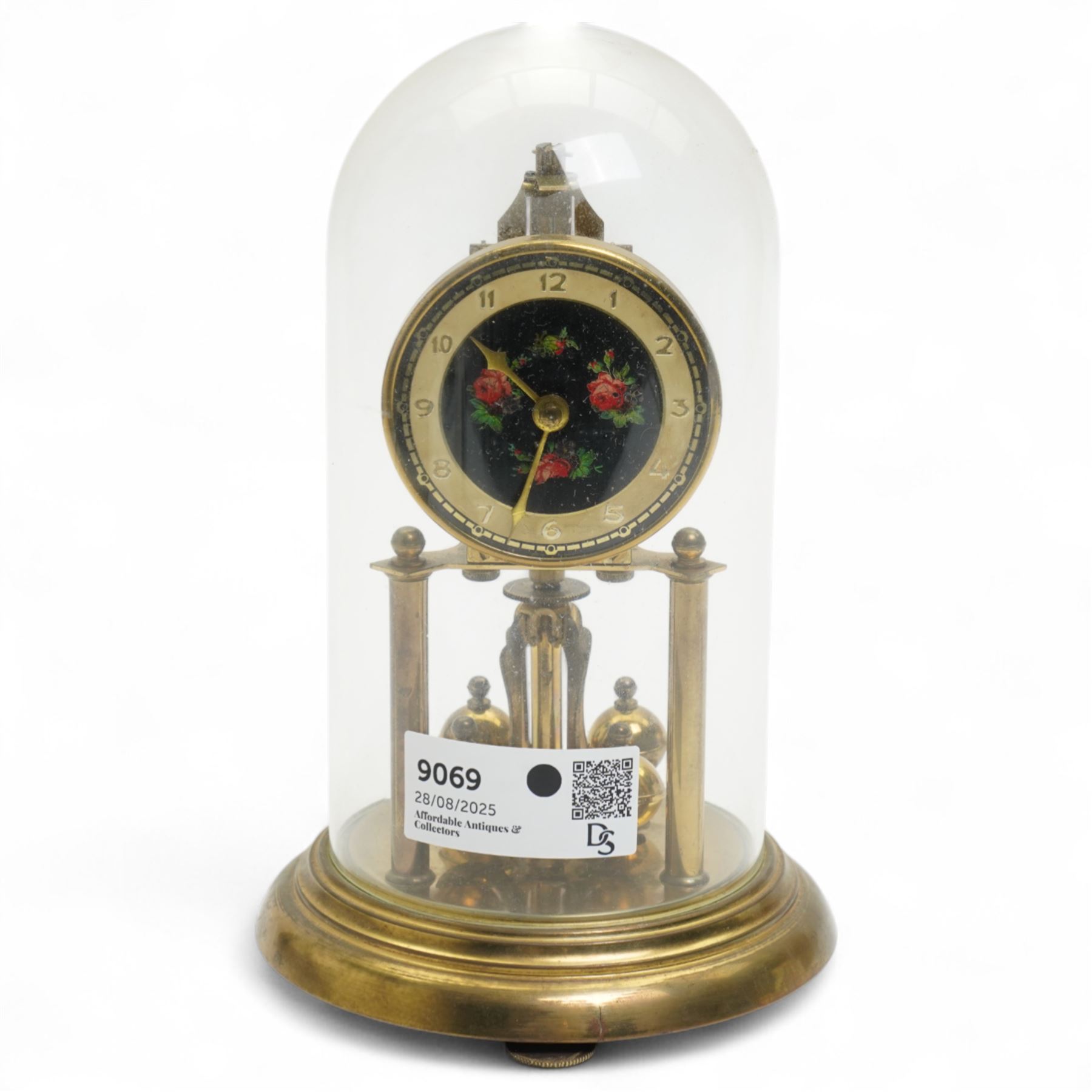 1960’s torsion clock with a skeleton movement and four ball oscillating pendulum, with a glass dome