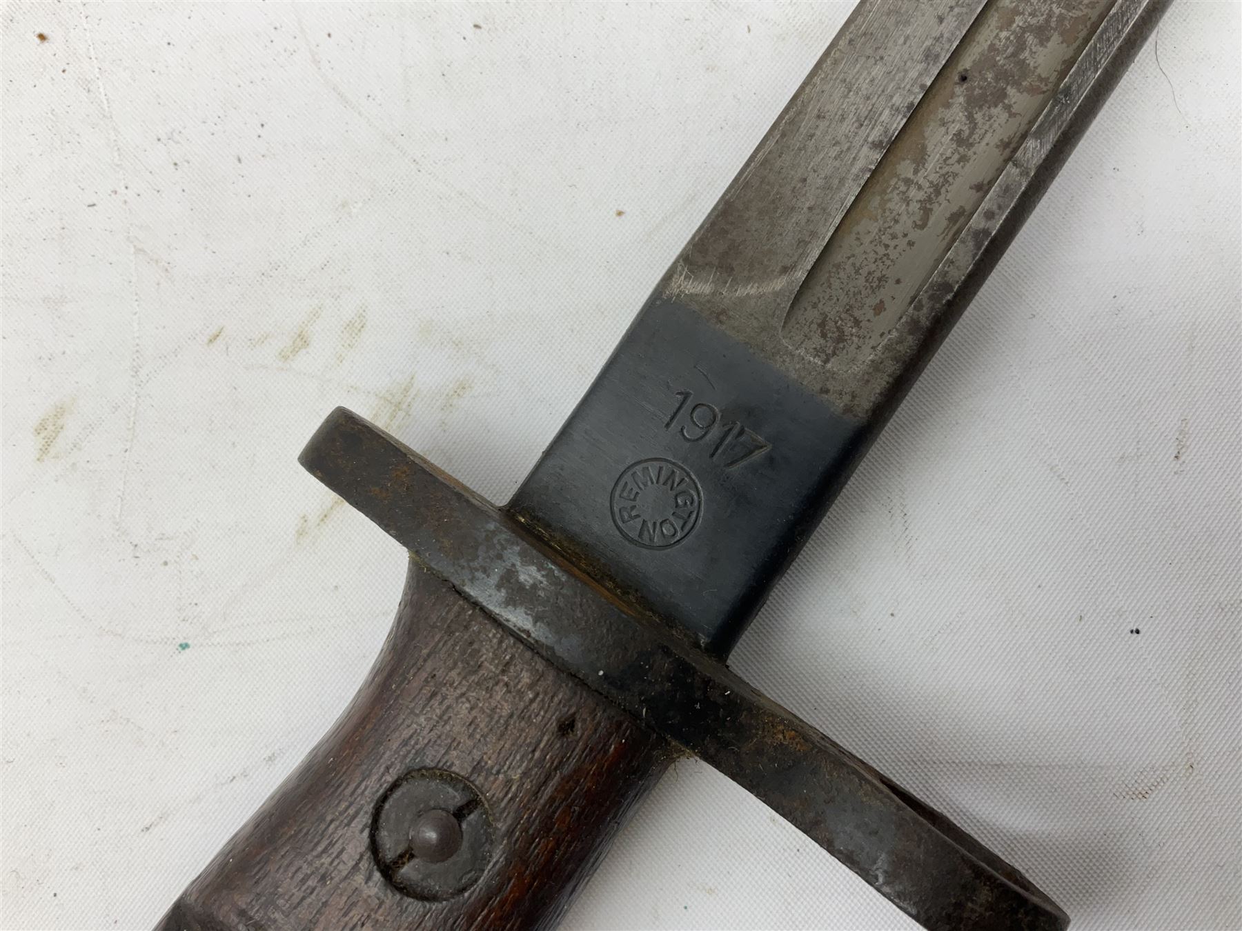 WW1 American Model 1917 Enfield bayonet by Remington with 43cm fullered steel blade; in leather scabbard with frog L59cm overall; and American M5A1 knife bayonet marked MILPAR COL to the cross-piece (no scabbard) (2)