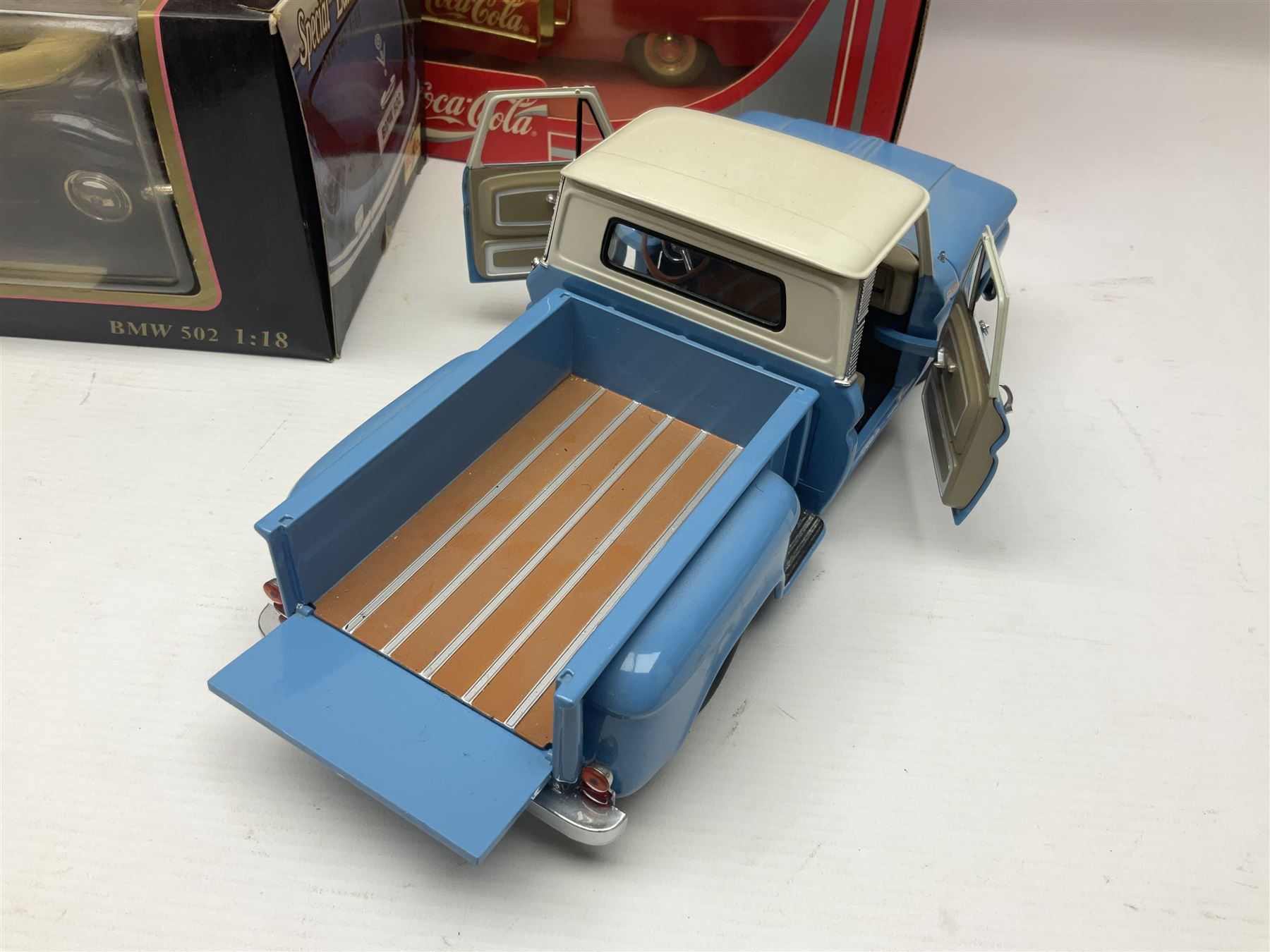 Seven 1:18 scale die-cast models by Ertl, Road legends, Maisto, Solido etc including two Coca Cola promotional vehicles; five boxed (7)