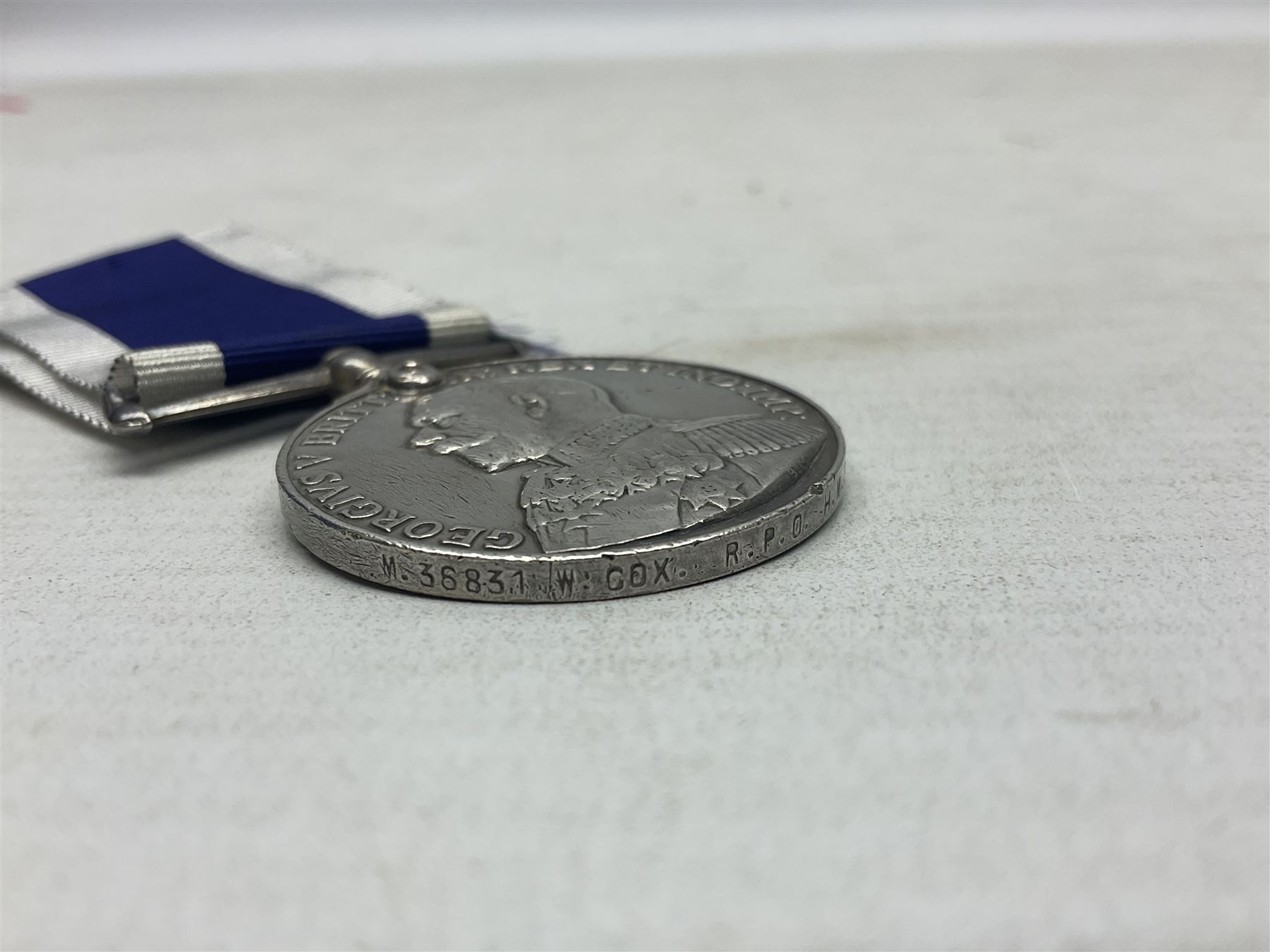 George V Naval long Service and Good Conduct Medal awarded to M.36831 W. Cox R.P.O. H.M.S. Vivid; with ribb