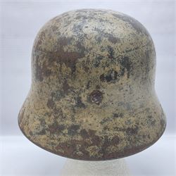 WW2 German Infantry M40 steel helmet with tropical finish and traces of single decal; with chin strap and leather liner marked 57 twice in red; back apron stamped 11 38