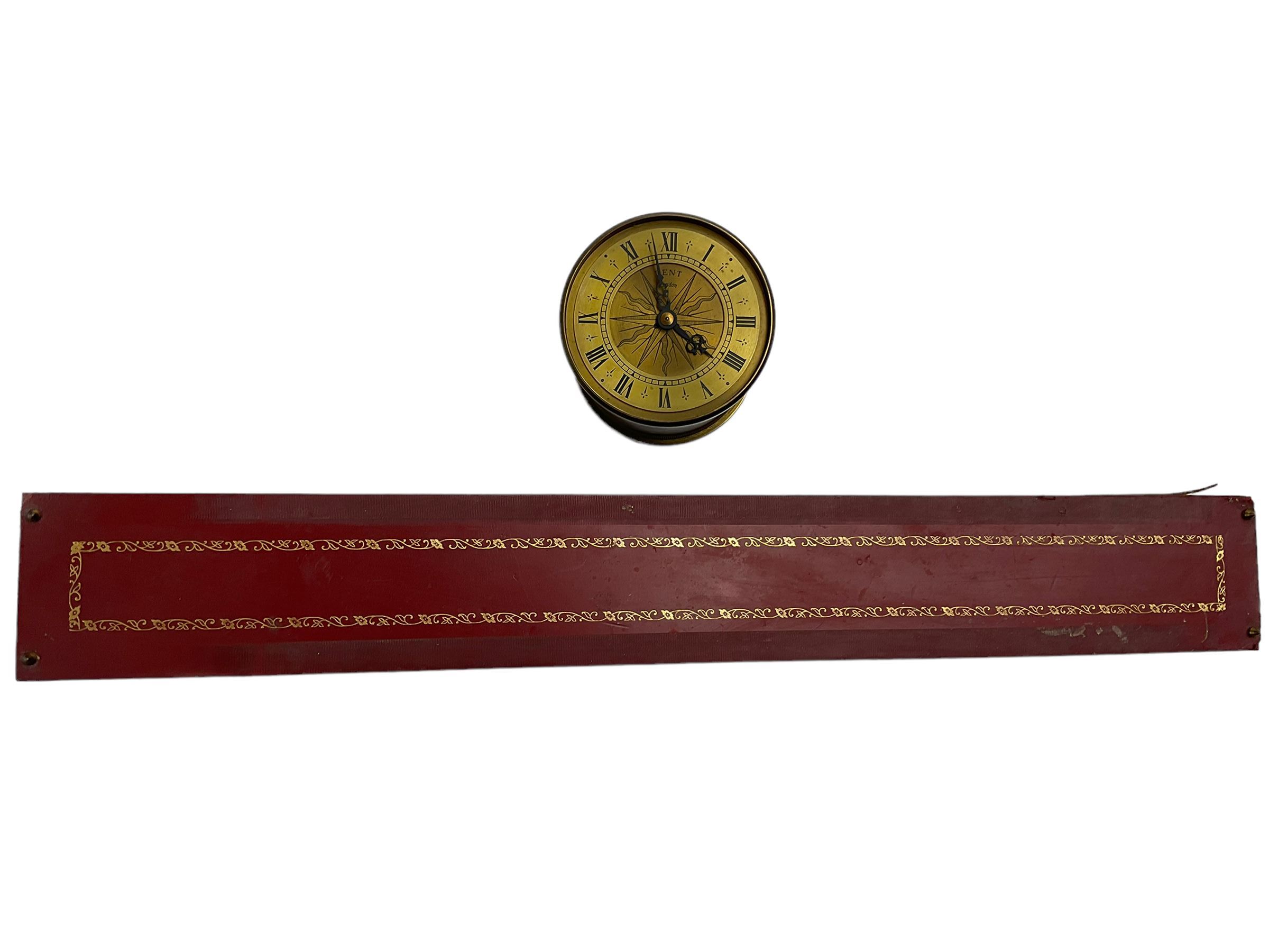 Dent incline plane clock, a 1970’s replica of a 17th century gravity clock manufactured by Dent of London in limited edition numbers, continuous lever balance movement driven with an internal counterweight, brass drum case with a gilt dial and silvered chapter ring, Roman numerals, engraved sunburst centre and pierced steel hands, inclined base with a red leather tooled top and the seven days of the week engraved to the front. With 500 limited edition certificate, No 154.