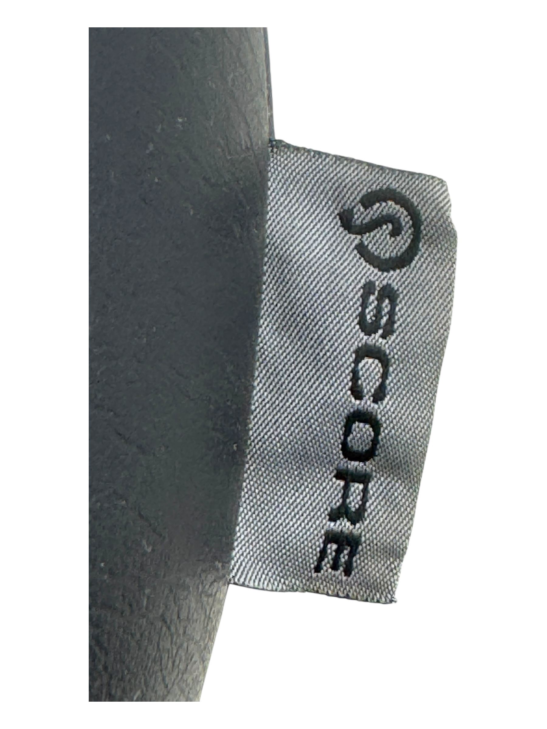 Score - contemporary 'Amazone' saddle stool, upholstered in black leatherette with adjustable height and tilt mechanism, raised on chrome spoke base fitted with castors