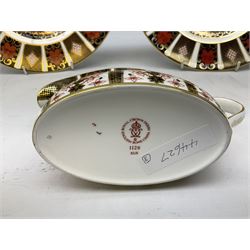 Royal Crown Derby 1128 pattern pair of 27cm plates; date codes for 1977 & 1979; and the matching sauce boat; date code for 1979; all with scratched maker's mark (3)