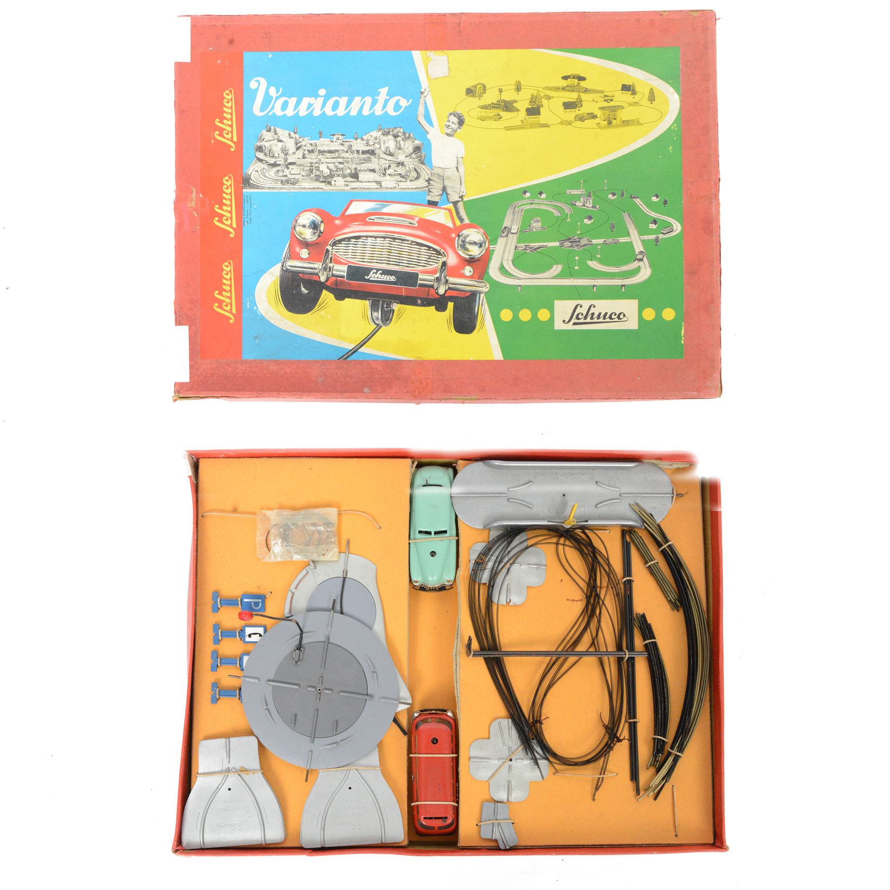 Schuco Varianto 3010 F boxed set, comprising two tinplate vehicles 3044 Varianto-Bus and 3041 Varianto-Limo, road sections, guidewires and signs, boxed