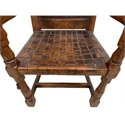 Mouseman - circa. 1930s set of six (4+2) oak dining chairs, panelled back carved with the Bagshawe family crest, the moto 'Forma Flos Fama Flatus' over an arm grasping a bugle-horn with ribbon tie and Yorkshire rose motif, adzed frame, leather lattice strap seat, on octagonal supports united by stretchers, two carvers and four side chairs, each carved with mouse signature, by Robert Thompson of Kilburn 

Provenance: Owned since manufacture by the Bagshawe family, descendants of the Staithes Group Artist Joseph Richard Bagshawe RBA (1870-1909).