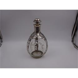 20th century Mexican silver overlaid Dimple whisky decanter/jug with stopper, the glass body overlaid with pierced floral silver decoration, with silver C handle and silver stopper, stamped 925 to base, H23.5cm
