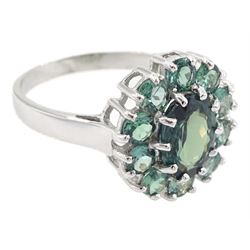 18ct white gold green sapphire cluster ring, oval cut sapphire of approx 1.40 carat, surrounded by ten round cut sapphires, Birmingham 2005, total sapphire weight approx 2.40 carat