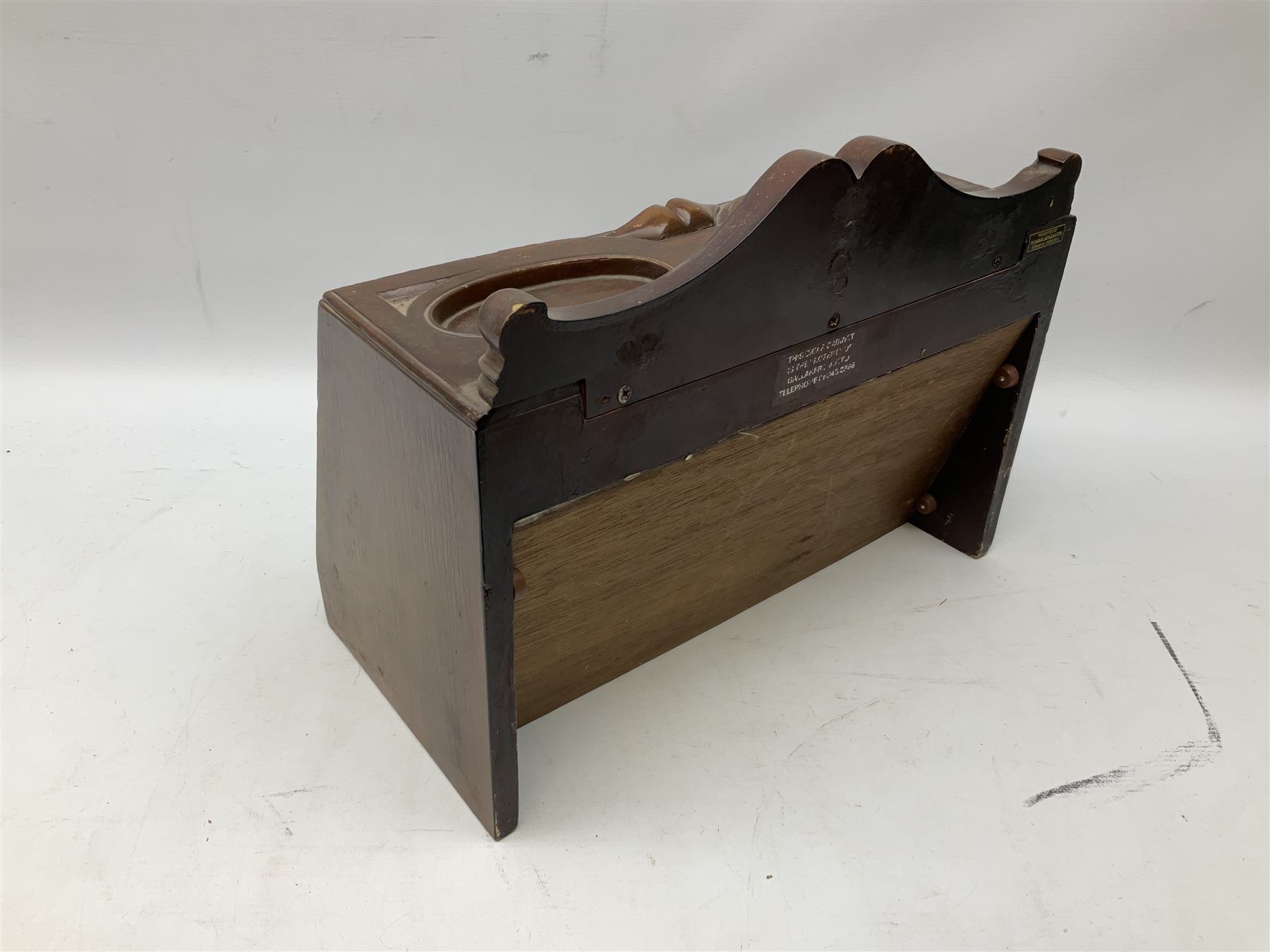 20th century Irish cigar shop display cabinet by Roger Aplin, Dublin, the box with hinged glazed front and decorative scroll top, H30.5cm