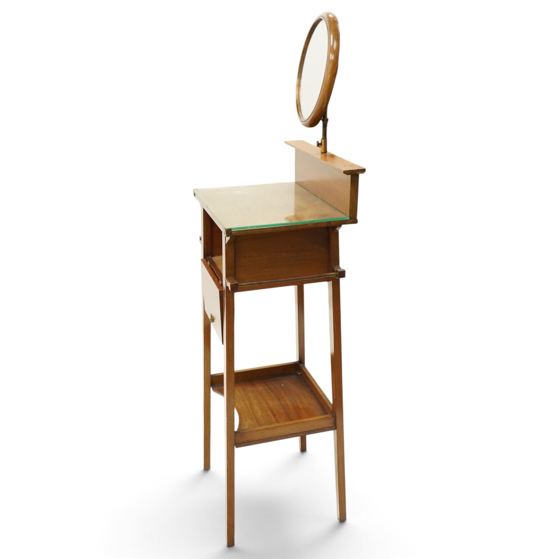 Early 20th century oak valet stand, raised back withy circular swivel mirror, over fall front compartment, raised on square supports united by concave under-tier