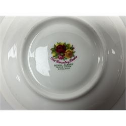 Royal Albert Old Country Roses part dinner and tea service comprising teapot, four tea cups and saucers, eight dessert plates, cake plate, cake stand, a tureen with cover, six dinner plates, an oval dish, two trinket dishes, bell and shoe decoration. 