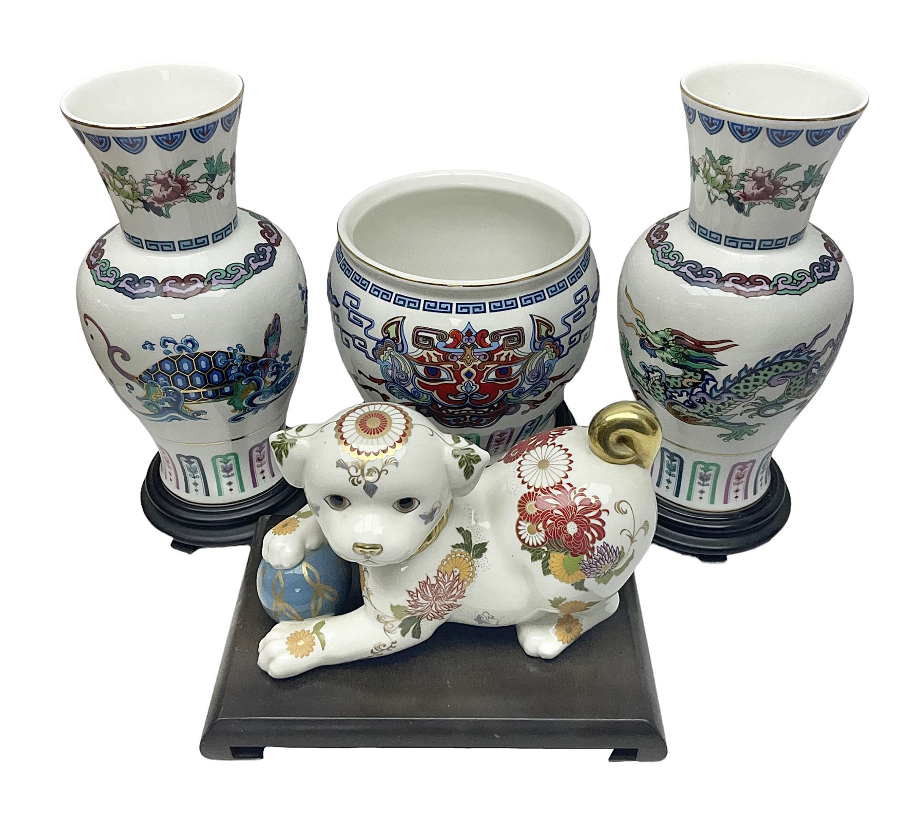 Franklin Mint Chinese style ceramics, comprising two vases, puppy and a planter, all on wooden stands