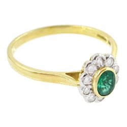 18ct gold emerald and diamond cluster ring, single oval cut emerald of approx 0.25 carat, surrounded by ten round brilliant cut diamonds, Birmingham 1995, total diamond weight approx 0.10 carat