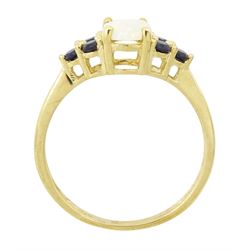 9ct gold opal and sapphire ring, single oval cut opal, with three sapphires set either side, hallmarked