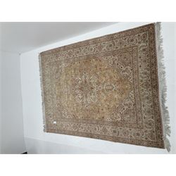 Fine Tabriz (300nspi) beige ground rug, central medallion with repeating border 