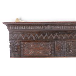 18th century and later carved oak panel, the carved cornice above a repeating boarder and two panels, H25cm, L81cm