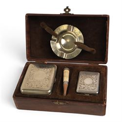 Three cigarette cases, modelled as bank notes, together with a smokers set including ashtray, cigarette case, ligher and cigarette holder, cased and other cigarette holders 
