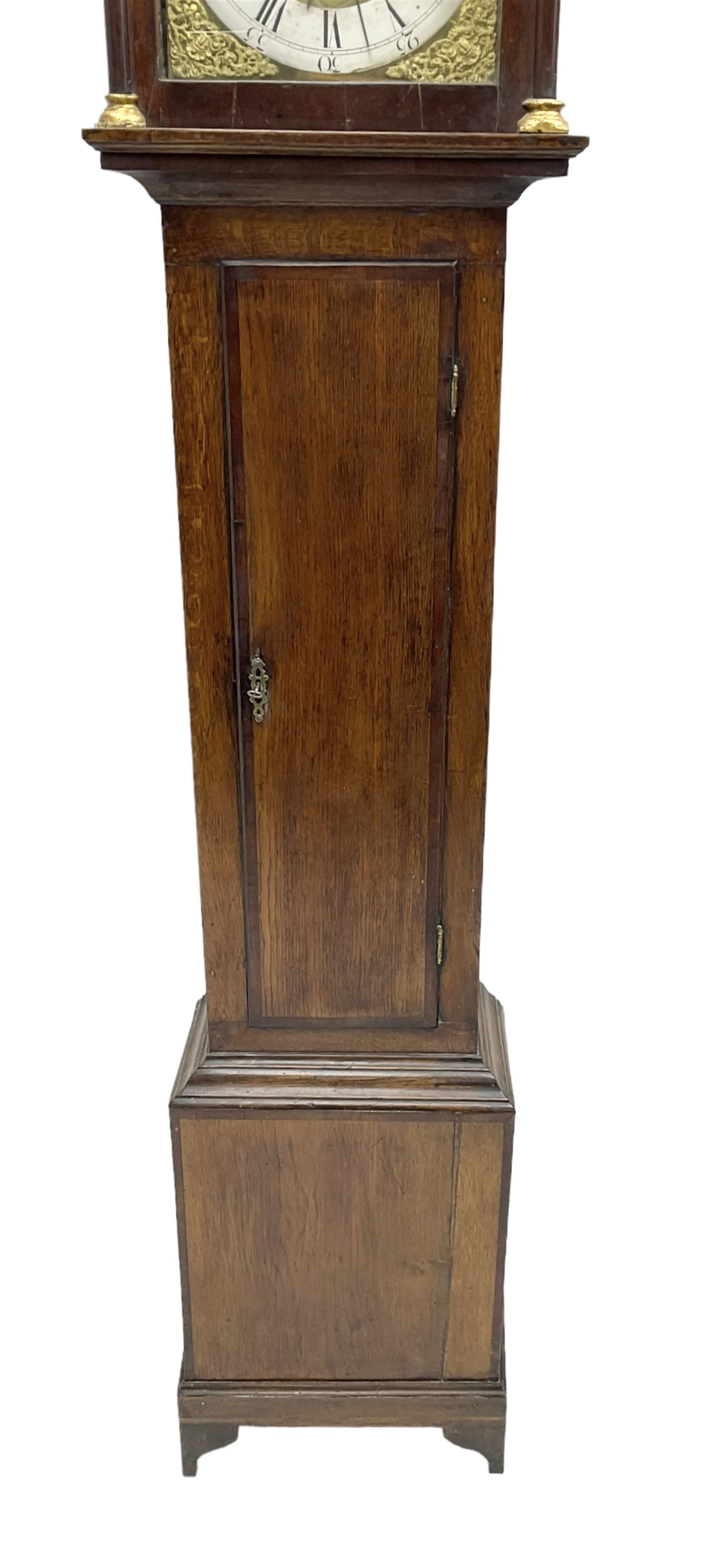 John Kemp of Yoxford (Suffolk) - 18th century oak 30 hour longcase clock c1770, with a later box top and finials, square hood door with attached pilasters and gesso capitals, long flat topped trunk door with a rectangular plinth and bracket feet, brass dial with cast spandrels and engraved dial centre, silvered chapter ring with Roman numerals and five minute Arabic's, with matching steel hands, birdcage chain driven movement with a recoil anchor escapement and count wheel striking. With weight and pendulum.
