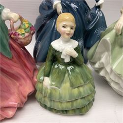 Four Royal Doulton figures, comprising Lady Charmain HN1949, Belle HN2340, Fair Lady HN2193 and Fragrance HN2334