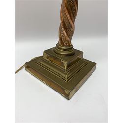 Early 20th century brass and copper Corinthian column table lamp, the square stepped brass base leading to a spiral twist copper column and brass Corinthian capital, H44.5cm 