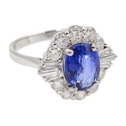 18ct white gold sapphire and diamond cluster ring, the central oval sapphire of approx 2.10 carat, with tapered baguette diamonds and round brilliant cut diamond surround, stamped 750