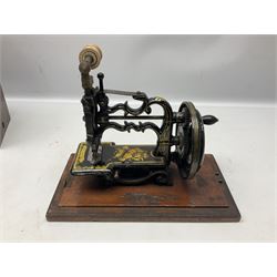 James G Weir 'The Globe' hand-cranked sewing machine, circa 1872, in black finish with gilt and flower painted decoration, the bed stamped Ja's G. Weir, 2 Carlisle Street, Soho Sq., London, with walnut locking carrying case and original manual, boxed H25cm 