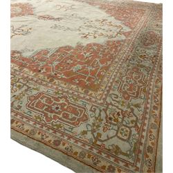 Large Persian pale sage ground carpet, the field decorated with central geometric medallion and tree of life motifs, the border with repeating geometric design decorated with stylised plant motifs