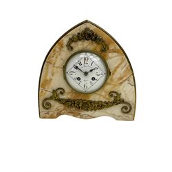 A 20th century French art-deco mantle clock in an amber-veined marble lancet shaped case with applied brass mounts, circular white enamel dial with elongated Arabic numerals within a diagonally designed minute track, dial inscribed 'Au Roy Yuetot, Rouen'  with an eight-day twin barrel countwheel striking movement, striking the hours and half-hours on a bell. With pendulum and key.



