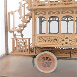 Early 20th century fretwork model of an omnibus, contained within glazed wooden case, case H45cm