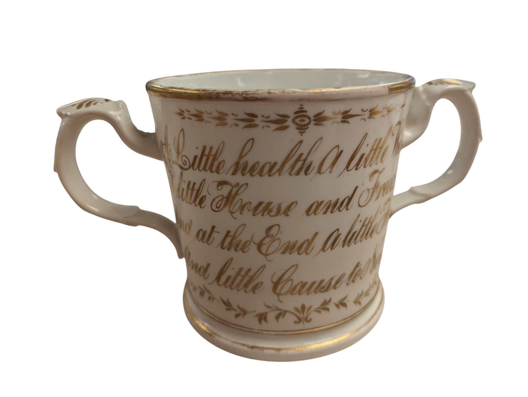 Pair of Art Deco dog bookends and a twin handled loving cup, painted with floral decoration and quote, loving cup H14cm