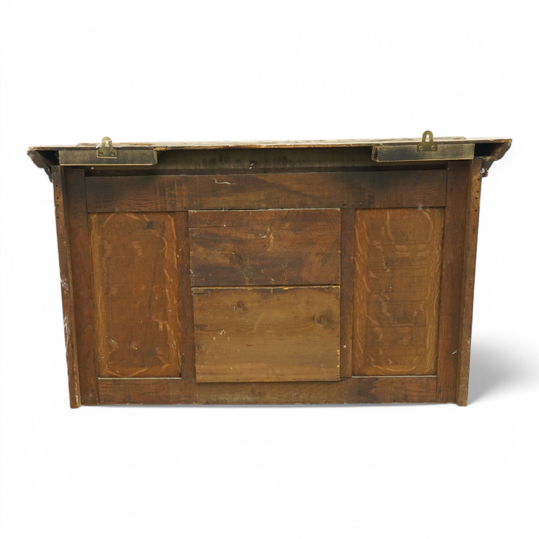 Victorian heavily carved oak wall mirror in distressed grey paint finish, moulded and chip carved cornice over central bevelled mirror and panelled front, the panels carved with urns and scrolled foliage, the uprights with fruiting foliage carved mounts 