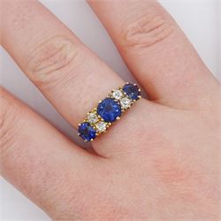Early 20th century 18ct gold three stone cushion cut sapphire and four stone old cut diamond ring, total sapphire weight approx1.85 carat, total diamond weight approx 0.30 carat