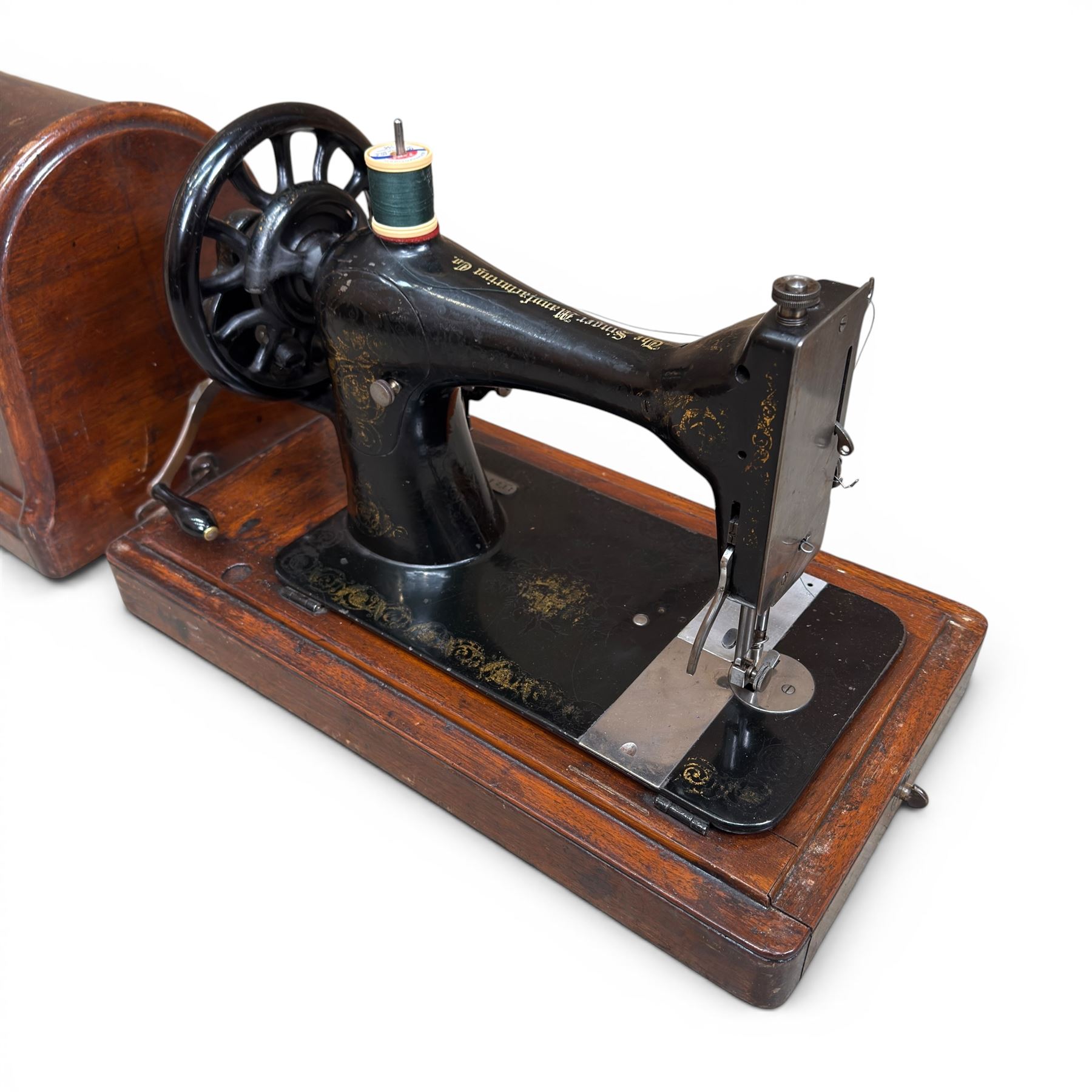 Three Singer wooden cased sewing machines 