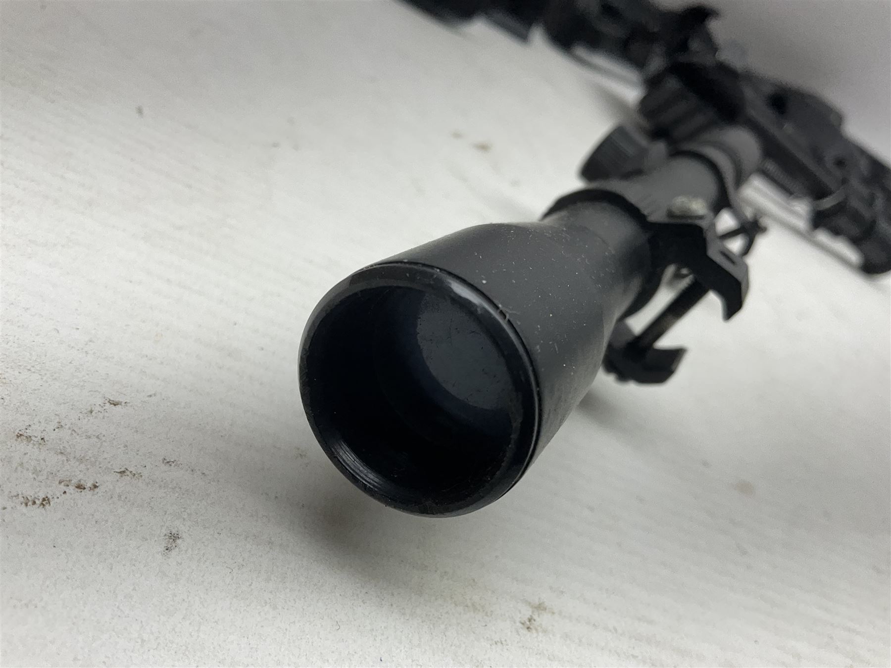Assorted shooting accessories including two telescopic sights, red dot sight,  two bi-pods, spirit level mount, two gun butts and two forward handles