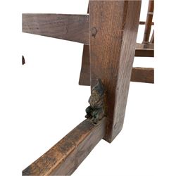 'Gnomeman' set of three oak dining chairs, panelled backs over curved seat rails with drop in rope rush seats, turned front supports with collar joined by plain stretchers, two with carved seated gnome figures, painted

Provenance - This collection of early 'Gnomeman' furniture comes to us directly from the Whittaker family. The pieces were made by the vendor's father Thomas Whittaker in the 1930/40s for his own use. During this time, he lived in York and made items for himself and friends. Whittaker adopted the gnome as a signature and trademark after his move to Littlebeck, Whitby.