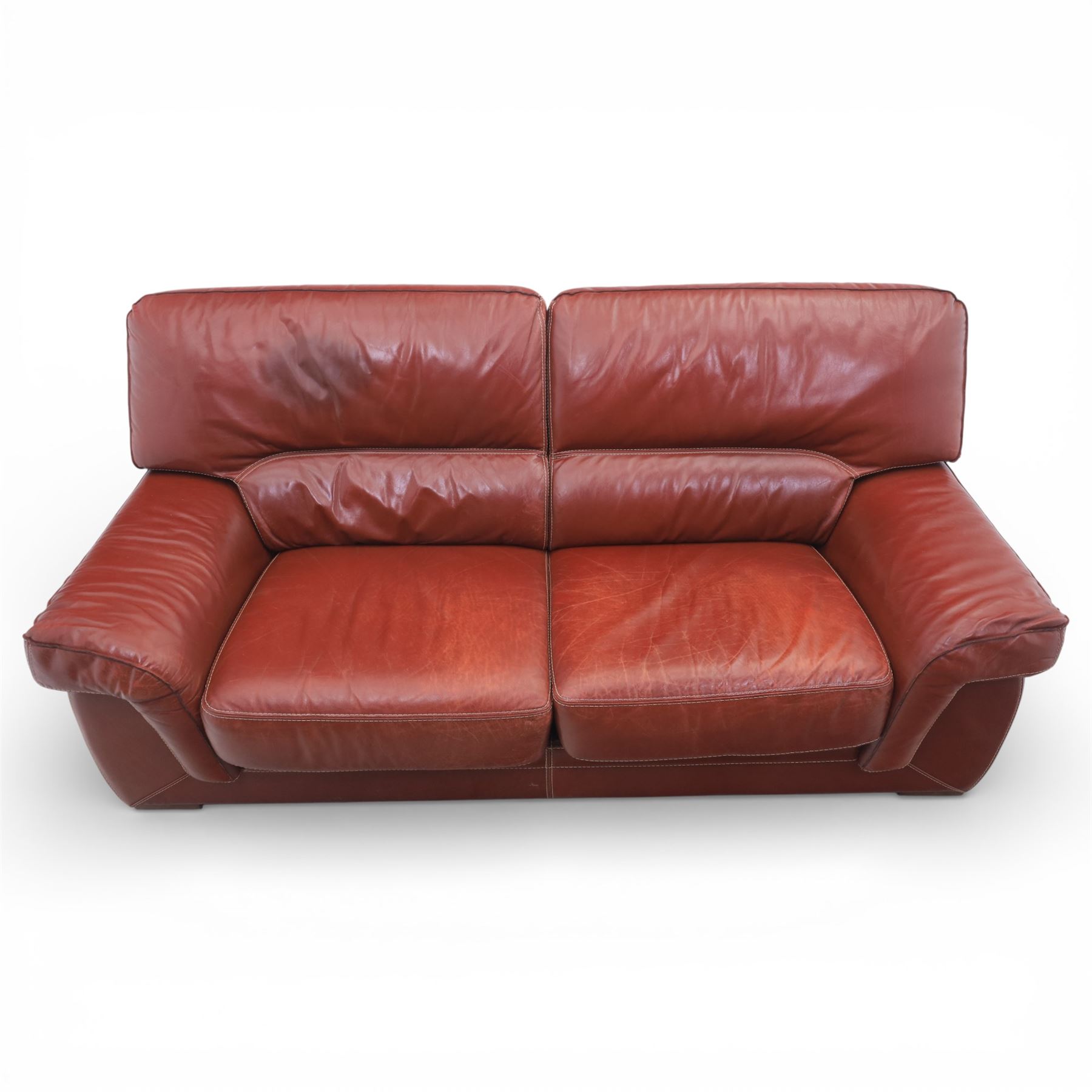 Fabrizio Mantellassi - 20th century Italian red leather suite, one three seat and two large armchairs, upholstered in deep red hide with stitched seam detailing, with magazine pockets to each side, the rectangular back cushions above broad padded arms and seat cushions, raised on low block bases

Sofa: H c98m, W 203cm, D 92cm
Armchair: H 98cm, W 113cm, D 92cm