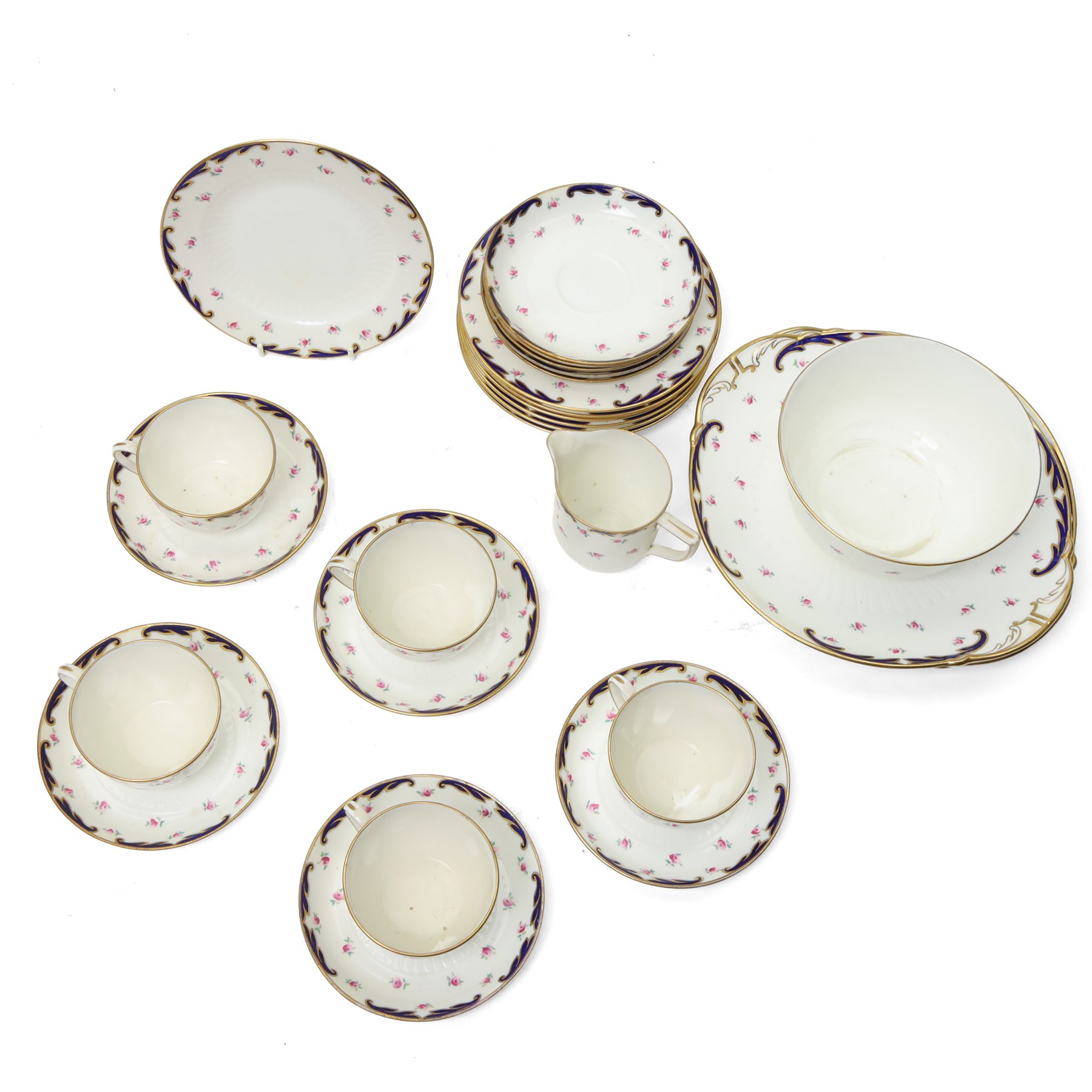 Wedgwood tea service decorated with floral sprays within a blue and gilt border comprising five cups, ten saucers, seven plates, two bread and butter plates, milk jug and sugar bowl