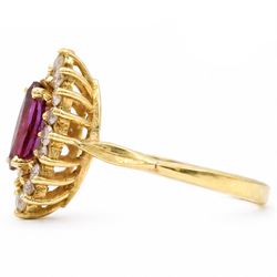 18ct gold ruby and diamond cluster ring, single marquise cut ruby of approx 0.90 carat, surrounded by sixteen round brilliant cut diamonds, stamped 750
