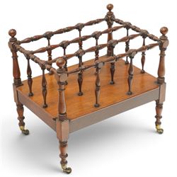 Victorian mahogany canterbury, four division top with bobbin turned rails and spindle uprights, rectangular base with moulded edge, on turned corner supports with brass castors