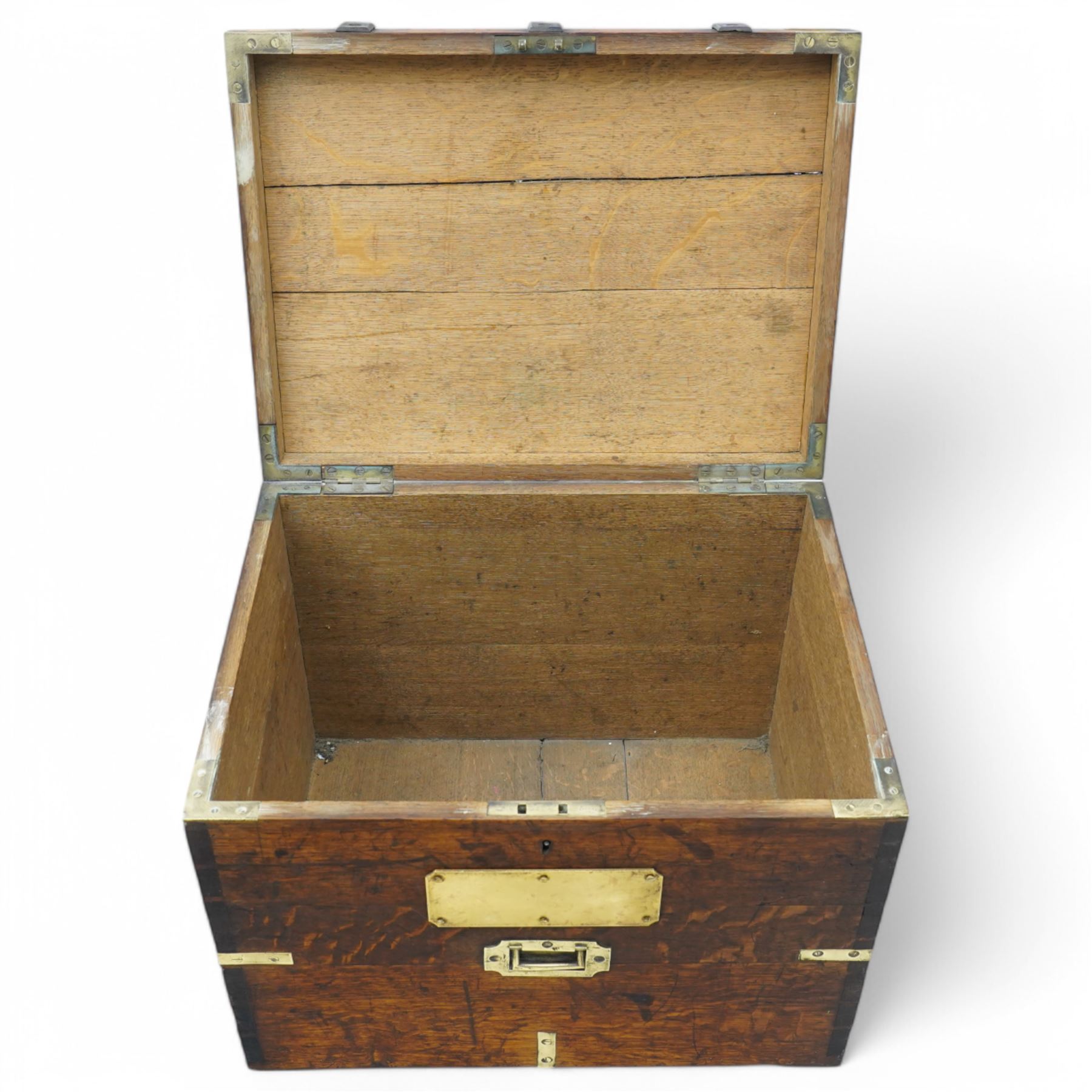 19th century oak and metal bound box, hinged lid enclosing vacant interior, bound with wrought metal straps and fitted with brass corner caps, two heavy weight brass carrying handles 