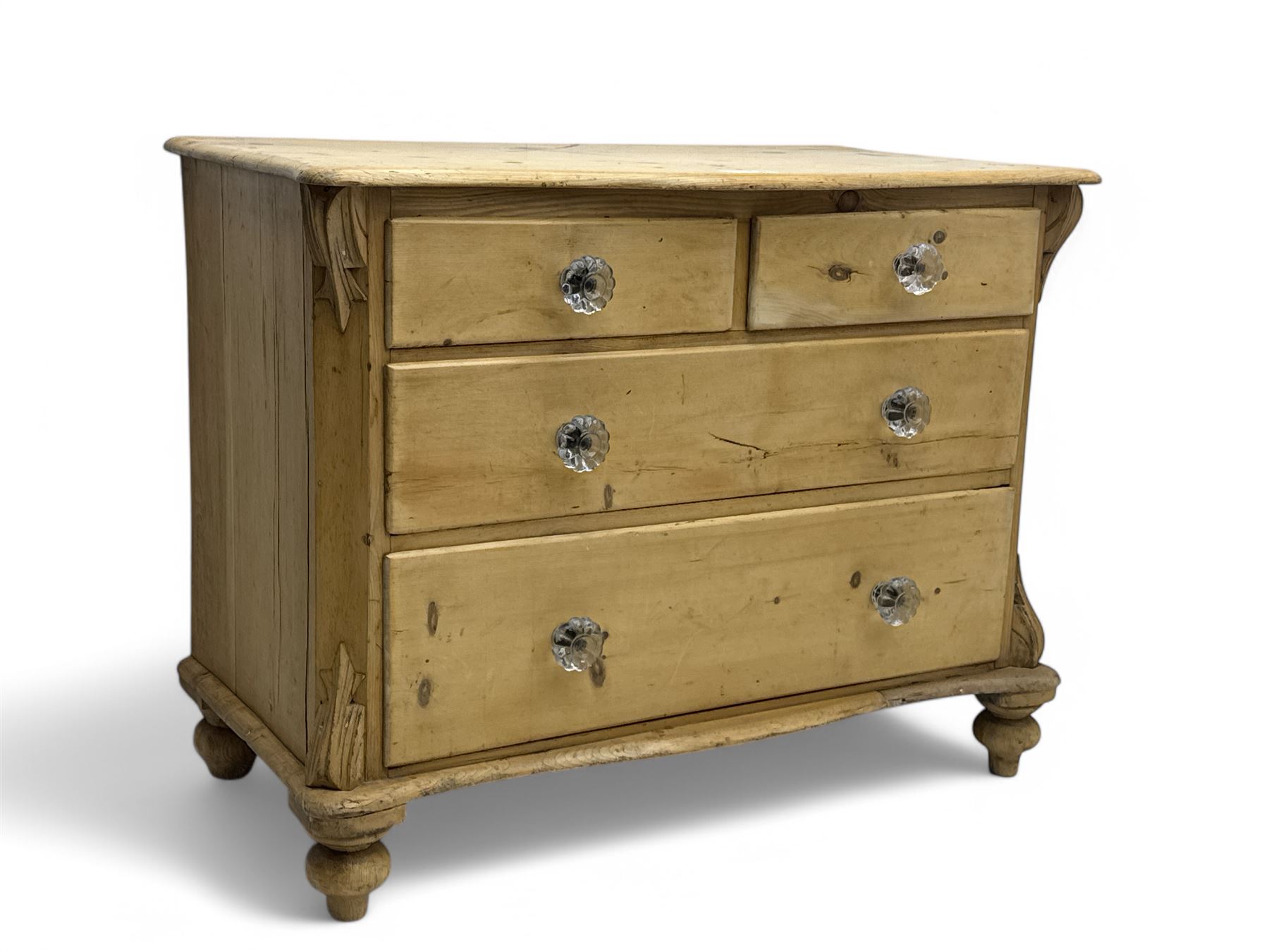 19th century continental pine chest, shaped serpentine top over two short and two long graduated drawers, on turned bun supports