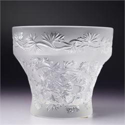 Three Lalique frosted glass tea light holders, decorated with the coriander and basil patterns, and another with trailing leaves, marked Lalique France to base, H7.5cm