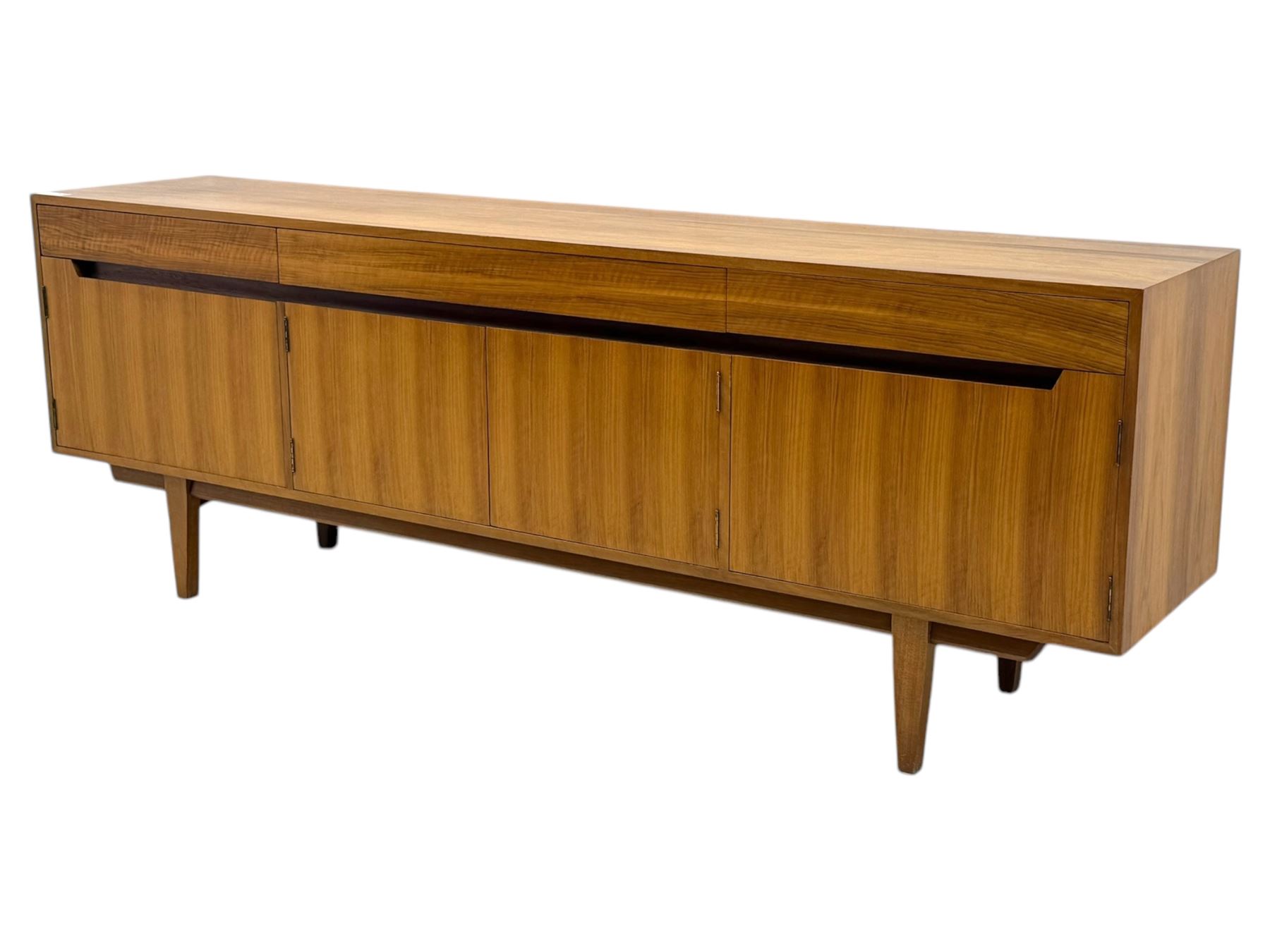 Younger - 1960s teak sideboard, three drawers over three cupboard, centre draw lined with baize with dividers, recessed handles with tapered feet