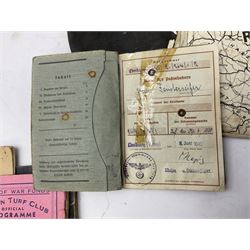 WW2 German War Pass (Wehrpass) identification paperwork for Walter Fensterseifer 2nd type booklet dated 8/6/1940, with signed photo of recipient in civilian suit. Born 31st January 1921. Numerous entries; together with quantity of small private photographs of German soldiers; One Million mark banknote 1923; 30th Corps in Germany booklet with Formation badge; and other WW2 paper ephemera